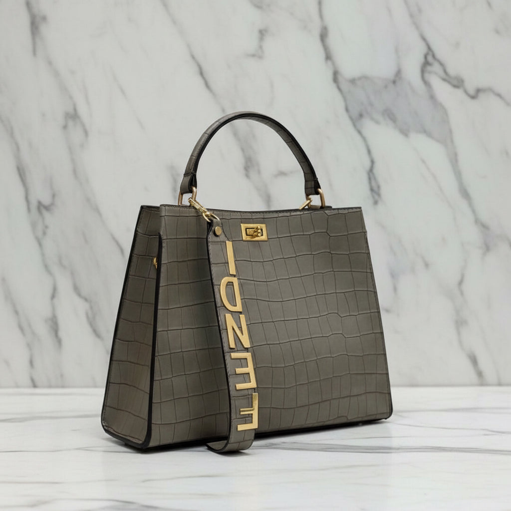 Fendi crocodile effect top handle bag with a gold tone Fendi strap