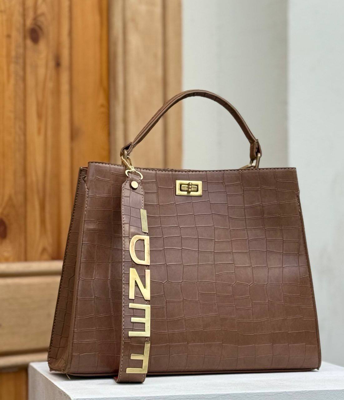 Fendi crocodile effect top handle bag with a gold tone Fendi strap