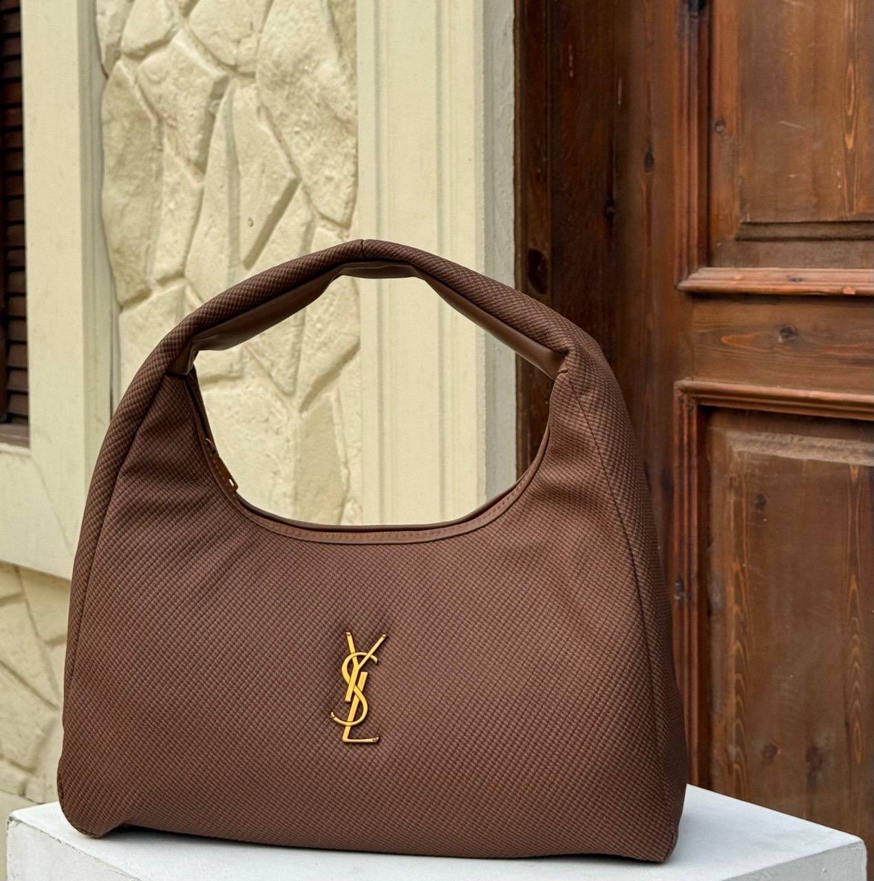 Saint Laurent Calypso - mini hobo bag in a padded lambskin - with gold-tone hardware