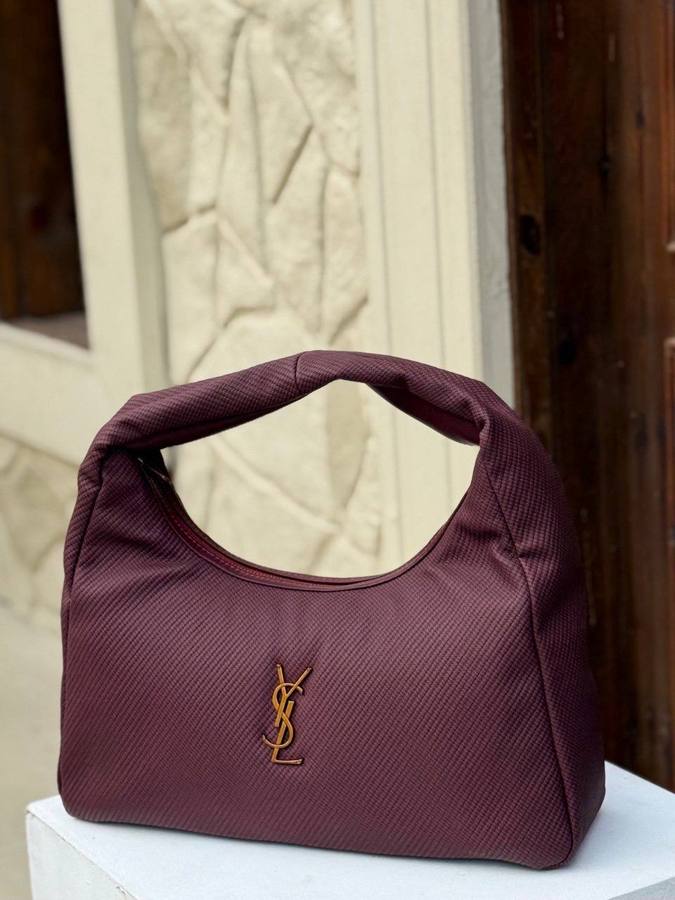 Saint Laurent Calypso - mini hobo bag in a padded lambskin - with gold-tone hardware